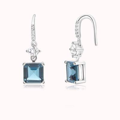 shiny natural London blue topaz gemstone earrings in sterling silver and rhodium plated