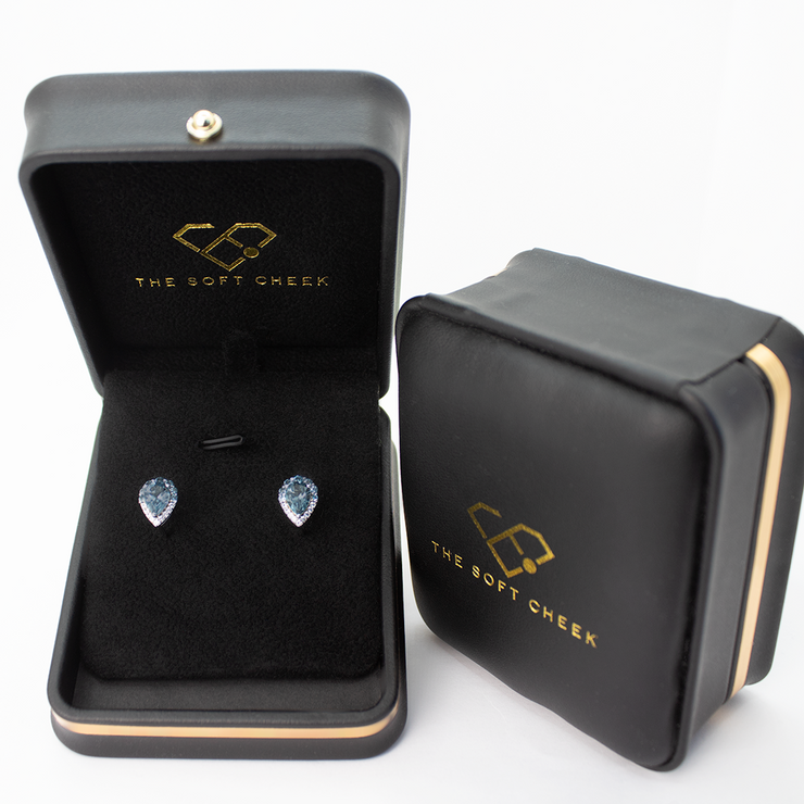 Exquisite fine jewelry earring delicately displayed in a sophisticated black velvet-lined box, evoking elegance and luxury. 