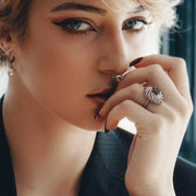 Image of a Model Wearing a Sterling Silver Ring with Natural Blue Topaz Gemstones for a Special Occasion