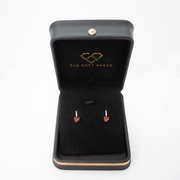 Beautiful red garnet earrings presented in an elegant jewelry box, perfect for any occasion